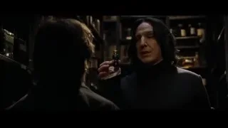 Man holding green bottle with woman watching — Harry Potter and the Goblet of Fire