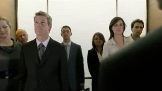 group of people in a hallway — Suits