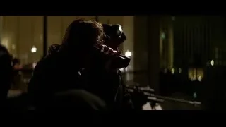 Person taking photo in dimly lit room — Batman: The Dark Knight