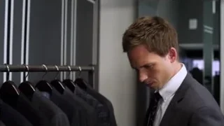 Man in suit looking at clothes in store — Suits