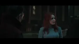 Man and red-haired woman in dimly lit room — Doctor Strange 2