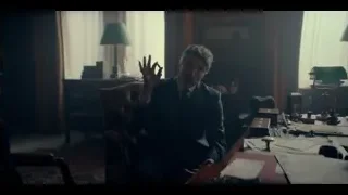 Man deep in thought at cluttered office desk — Peaky Blinders