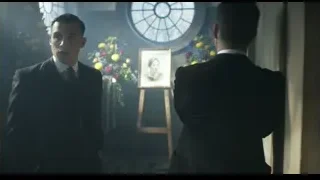 Two men in suits by portrait, stained glass — Peaky Blinders