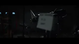 Man with telescope in dark room — Iron Man 3