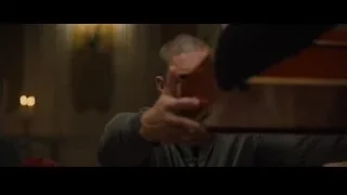 man with beard sitting at table — Creed 2