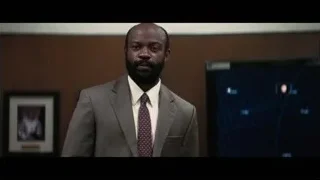 Man in suit standing in wooden room — Interstellar