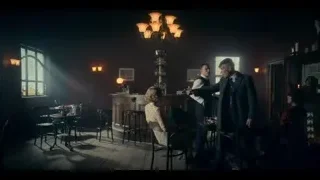 people talking at dimly lit bar — Peaky Blinders
