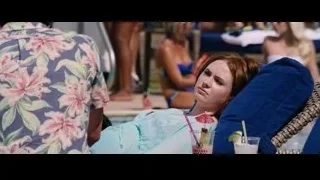 Woman lying on lounge chair by pool — The Big Short