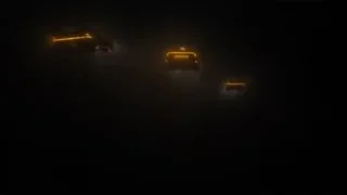 three cars with orange headlights in dark — Blade Runner 2049