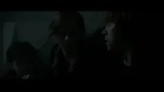 three people sitting in dimly lit room — Harry Potter and the Deathly Hallows 2