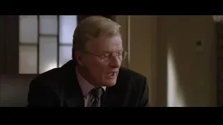 Elderly man in suit looking at camera — Batman