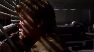 man looking out window in dark room — Breaking Bad