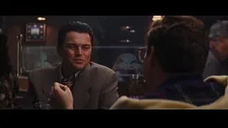 man in suit talking on phone by window — The Wolf Of Wall Street