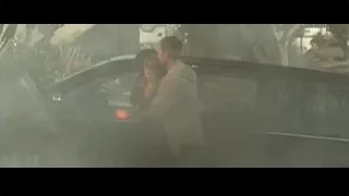 man and woman embracing in front of car — Furious Seven