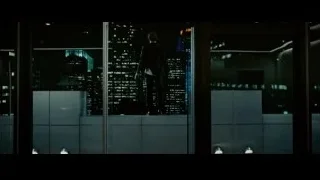 man in suit on balcony overlooking city — Limitless