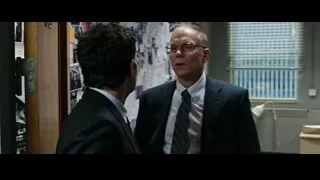 Two men in suits talking in office — Now You See Me 2