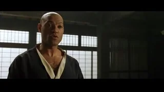 bald man deep in thought by window — The Matrix