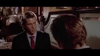 man in suit deep in thought in restaurant — American Psycho