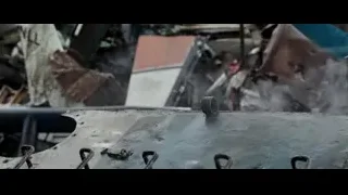 Person looking through hole in rubble — Deadpool