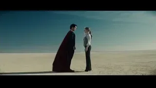 man in red cape and woman in desert — Superman: Man of Steel