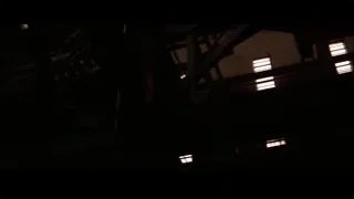 Dark eerie building with lit windows — Batman