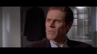 Man in suit looking at camera smiling — American Psycho
