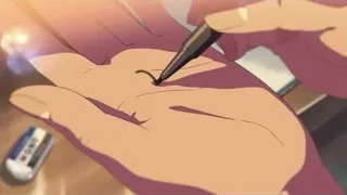 person drawing tattoo design on hand — Your Name