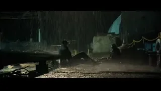 people in rainy industrial area at night — John Wick