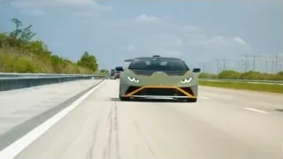 green and orange Lamborghini driving on highway — Sports Cars