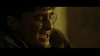 young man laughing in dimly lit room — Harry Potter and the Deathly Hallows 2