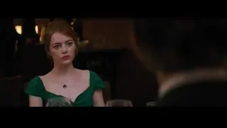 Young woman in green dress at restaurant — La La Land