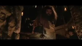 man stirring pot with two boys watching — Harry Potter and the Philosophers Stone