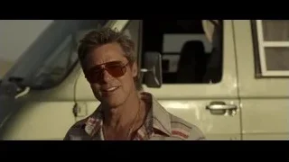 Man in sunglasses by white van on beach — F1
