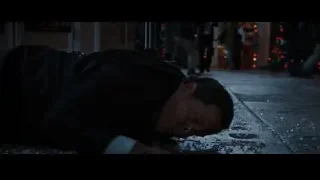 man lying on ground by Christmas tree — Iron Man 3