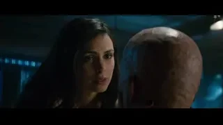 woman with tense expression and bald man's head — Deadpool 2
