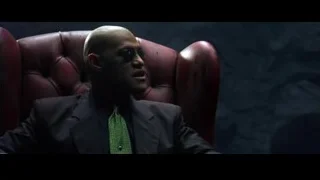 bald man in suit in armchair with smoke — The Matrix
