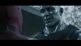 Man with metallic face and red cape — Deadpool 2