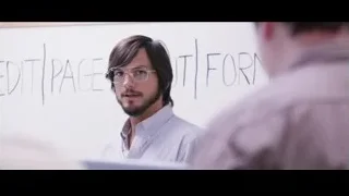 Man with glasses presenting at whiteboard — Jobs