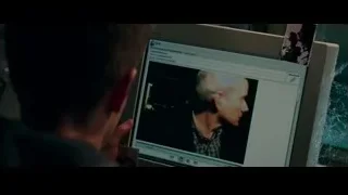 Man looking at photo on computer monitor — The Amazing Spider Man 2