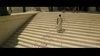 Man walking up stairs with rose petals — Gladiator 2