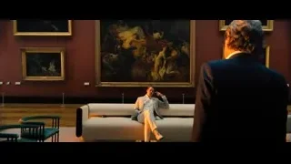man in white suit in museum — John Wick: Chapter 4