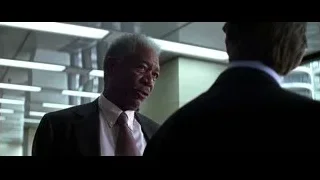 Two men in suits with city view — Batman: The Dark Knight