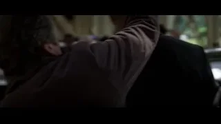 man facing armed police officer — Batman: The Dark Knight