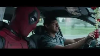 Deadpool in car holding red flowers — Deadpool