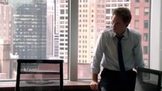 man looking at city skyline from office — Suits