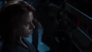 young woman in dimly lit room — The Avengers