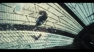 Large dinosaur walking towards explosion in jungle — Jurassic World