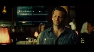 Man smiling in dimly lit restaurant — Limitless