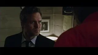 Man in suit in dimly lit room with red jacket — Now You See Me 2