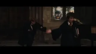 Young boys in school uniforms reading in church — Harry Potter and the Philosophers Stone